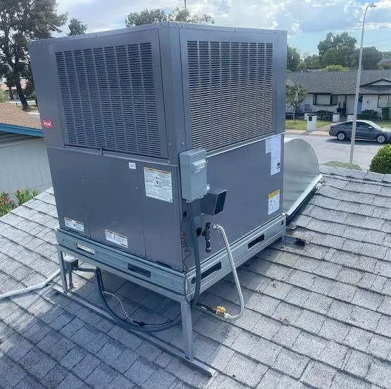 New Bryant rooftop package unit installed on a shingle roof
