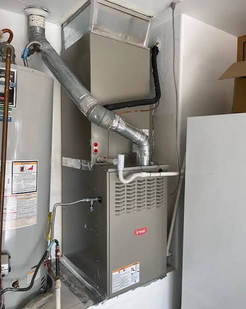 Gas furnace replacement installed in a garage